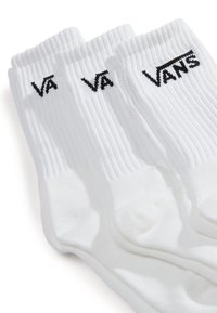 Vier Paare weiße Socken mit gerippter Textur, ausgestattet mit dem schwarzen "VANS"-Logo am Bündchen, ideal für Freizeitkleidung.