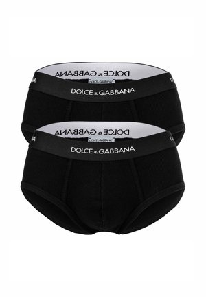 Bañadores de algodón negro con relieve, que cuentan con una cinturilla blanca con el logo "DOLCE & GABBANA". Incluye dos pares apilados juntos.