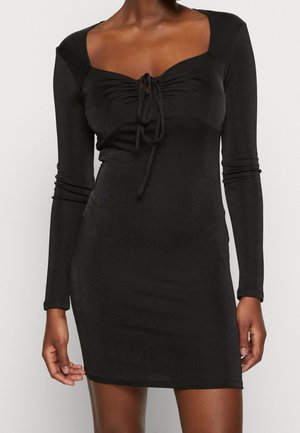 Black long-sleeve dress, fitted silhouette with a square neckline and gathered detail at the front. Soft, slightly textured fabric.