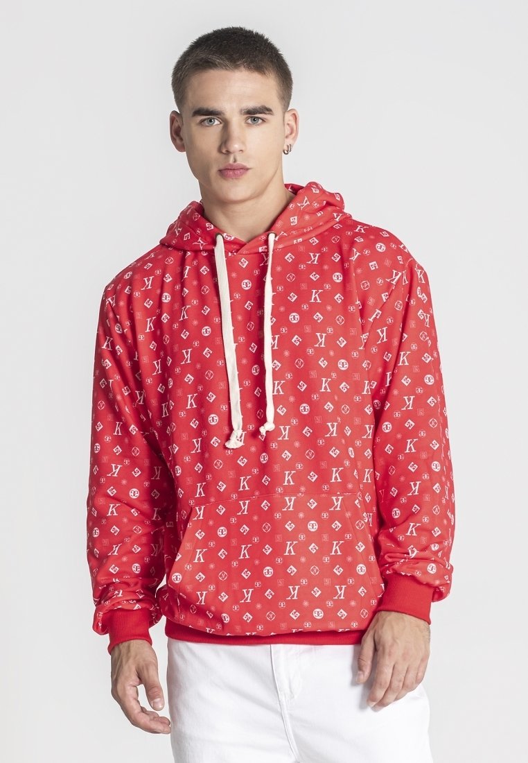 Sudadera roja con capucha que presenta un patrón de logotipos repetidos, capucha con cordón y puños acanalados. Confeccionada con una tela suave y un ajuste cómodo.