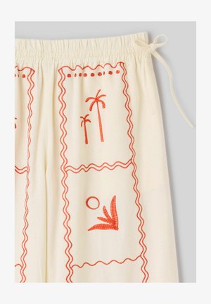 Tissu crème avec palmiers et soleil brodés en orange, taille élastique et détail de nouage latéral.