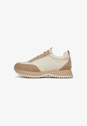 Beige and tan sneaker with a textured suede and smooth leather upper, lace-up design, and a chunky, ridged rubber sole.