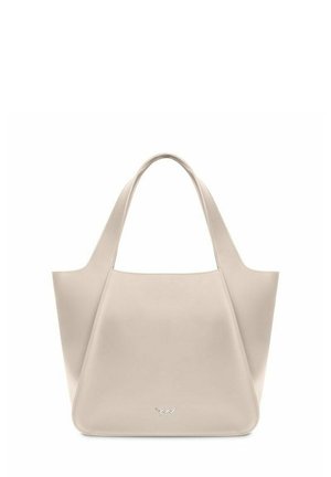 Light beige tote bag made of smooth leather, featuring a minimalist shape, wide handles, and a branded metallic accent at the base.