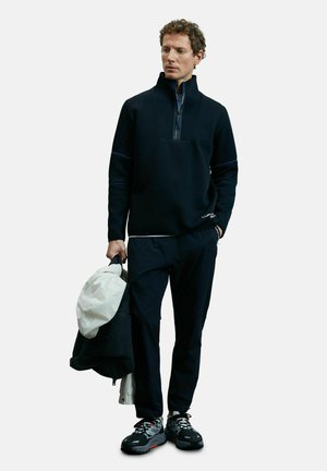 FIRST  - Jogginghose - schwarz