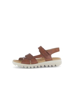 Brown leather sandal with open toe and adjustable strap. Features a cushioned footbed and a white textured rubber outsole.