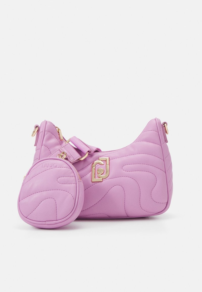 Petit sac à main matelassé rose avec une pochette à pièces ronde assortie attachée, avec des ferrures dorées et un détail logo.