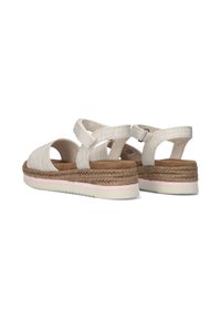 Geweven stof sandalen in lichtbeige, met een gepolsterde voetbed, platte hak met geweven jute details en verstelbare kruisspenen.