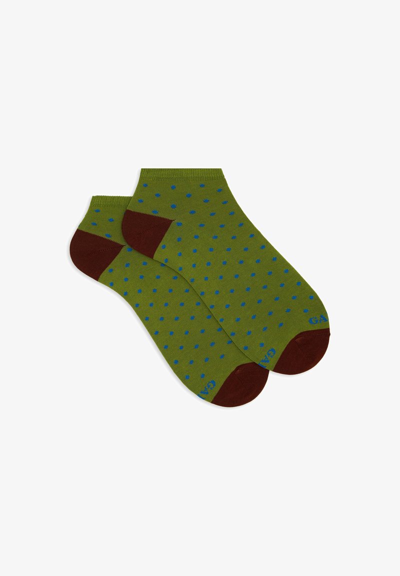Calze verdi con pois blu, tallone e punta marroni scuri, e una consistenza comoda e elastica. Nome del marchio visibile sul lato.