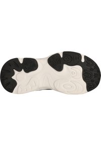 Semelle de chaussure avec une base blanche et du caoutchouc noir présentant divers motifs en vagues, avec des textures antidérapantes pour une meilleure adhérence et stabilité.