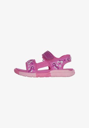 Rosa Kindersandalen mit Klettverschluss, versehen mit Seepferdchenmustern und perforiertem Design für Atmungsaktivität. Hergestellt aus flexiblem Gummimaterial.