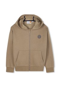 Felpa con zip beige con tasca frontale, polsini e orlo a costine, rivestimento interno di una tonalità leggermente più scura, presenta un piccolo logo sul petto.