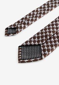 Next Slips - brown elephant