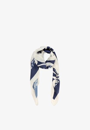 Jedwabna chusta z granatowymi, białymi i jasnoniebieskimi geometrycznymi i kwiatowymi wzorami, złożona i luźno zawiązana w węzeł.