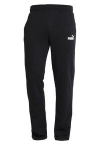 Svarta sweatpants i mjukt tyg, med elastisk midja och en vit Puma-logotyp på vänster lår. Raka ben.