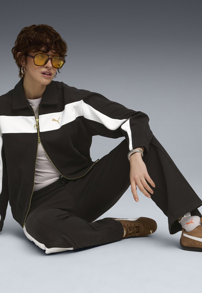 Puma RELAXED - Lehká bunda - black