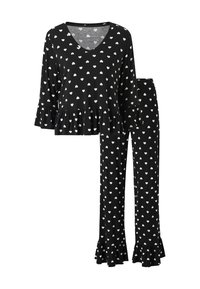 Black pajama set with white heart print. Top features a V-neck and ruffled hem; pants are long with a ruffled bottom. Soft fabric texture.
