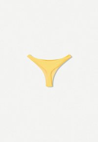 Rumena tangica bikini dno, izdelana iz rebraste tkanine. Ima nizko zasnovo in minimalno pokritost, primerna za uporabo kot kopalke.