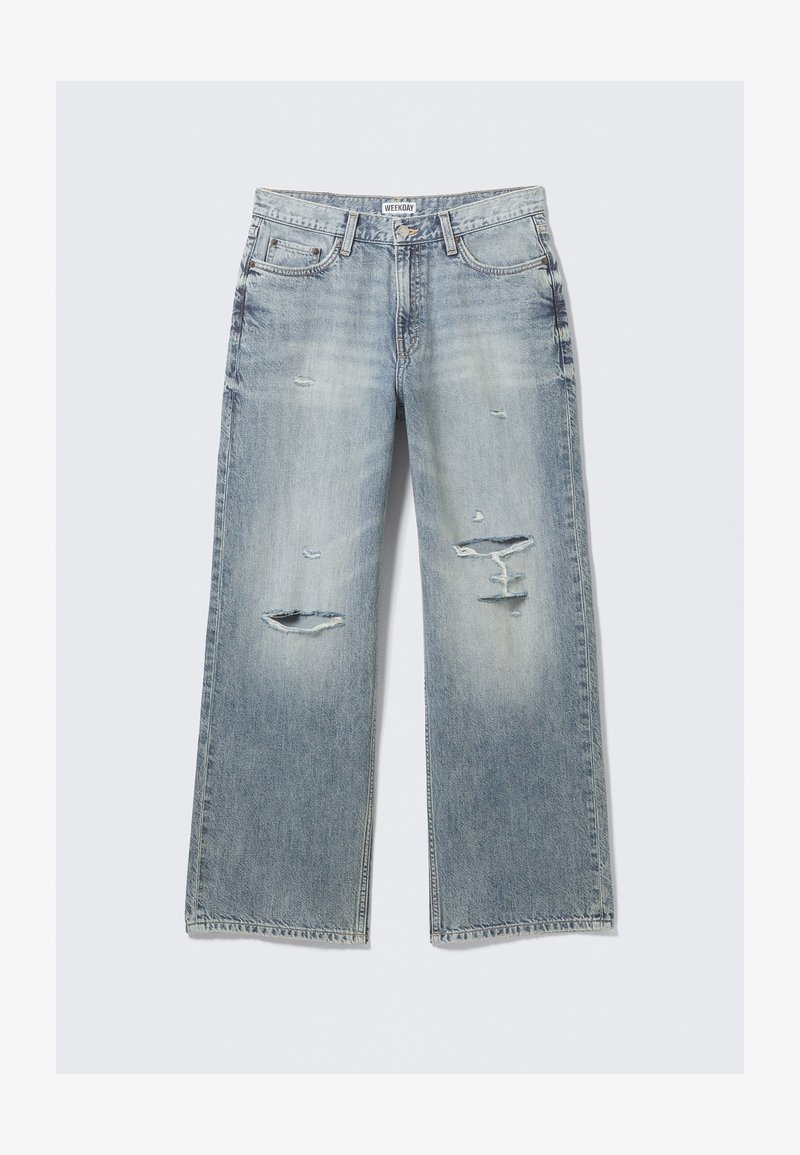 Svijetloplave široke traperice od trapera s izlizanim detaljima i višestrukim poderotinama. Klasični dizajn s pet džepova i vidljivim šavovima.