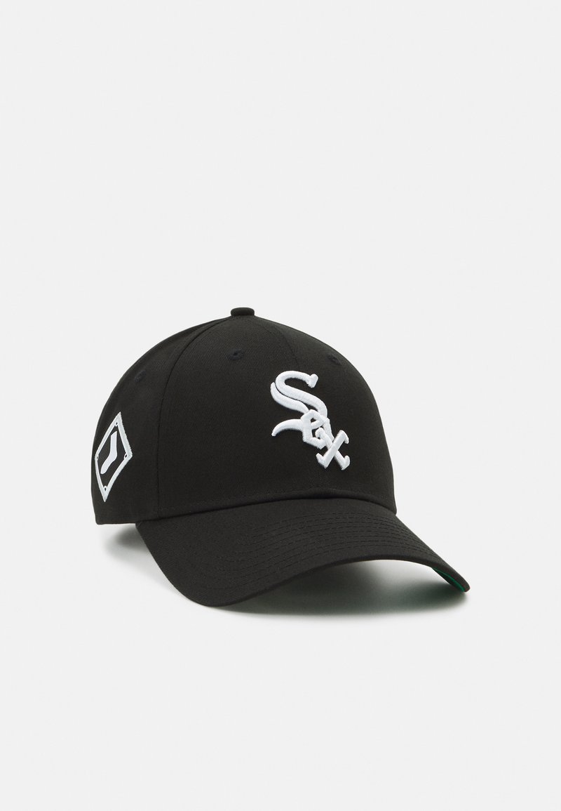 Black baseball cap with white embroidered logo and diagonal white patch on the side. Features a curved brim and a structured crown.