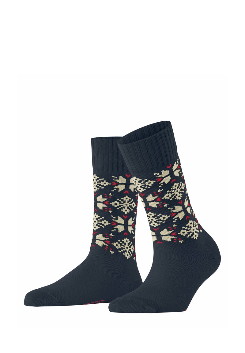 Calzini blu navy con bordo a coste presentano un motivo geometrico a fiocco di neve in crema e rosso. Texture morbida con rinforzo sulla punta e sul tallone per una maggiore durata.