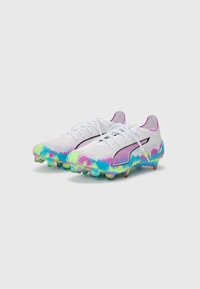 White football boots with a colorful tie-dye pattern in blue, pink, and green. Features laces, a black logo, and studded soles.