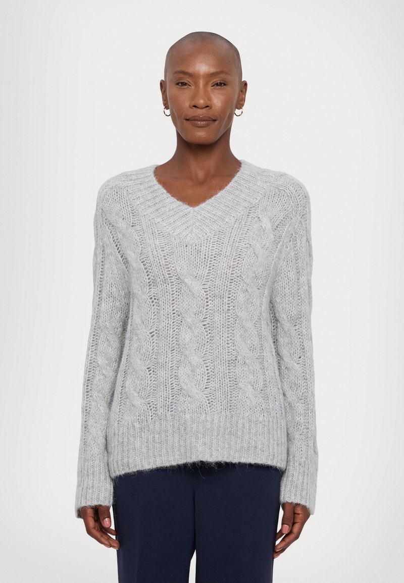 Light gray cable-knit sweater with a v-neck, long sleeves, and ribbed hem. Made from a soft, textured material that appears cozy.
