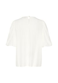 Blusa bianca con vestibilità rilassata, maniche corte a sbuffo e apertura a chiave sul retro fissata con un piccolo bottone dorato. Tessuto dalla trama liscia.