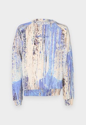 Sweatshirt met ronde hals in blauw en beige met een abstract verfspattenpatroon. Geribbelde manchetten en zoom zorgen voor structuur en pasvorm.