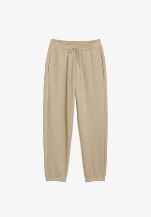 Beige trainingsbroek met elastische tailleband en trekkoord. Smalle pijpen met boorden bij de enkels en zijzakken. Zachte stof, minimalistisch ontwerp.