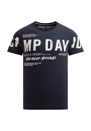 Navy blue T-shirt with large white text "CAMP DAVID" across chest and sleeves, plus smaller phrases referencing beaches and ocean coordinates.