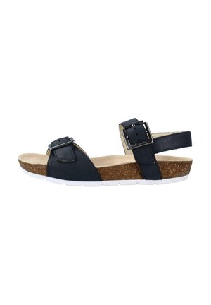 Sandalia negra con correas ajustables y hebillas, plantilla de corcho, suela de goma blanca y diseño de cuña baja para mayor comodidad y soporte.