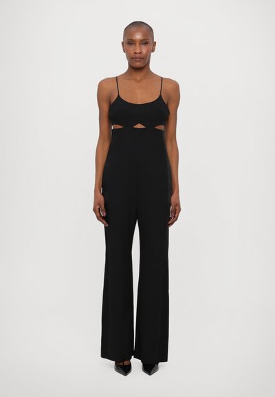 Zwarte jumpsuit met spaghettibandjes, uitsnijdetail onder de buste en wijd uitlopende pijpen. Gemaakt van soepele stof met een stijlvolle afwerking.