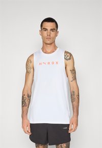 White sleeveless athletic tank top featuring orange "HYROX" logo on chest. Smooth fabric, round neckline, paired with black shorts.