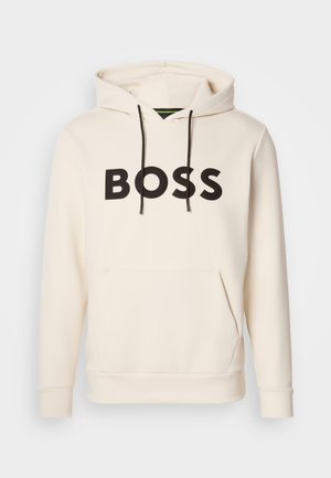 Cream-colored hoodie with black "BOSS" text on the chest, black drawstrings, and a front kangaroo pocket.