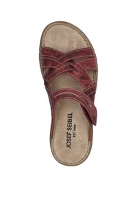 Red leather sandal with cross-strap design and beige footbed. Features white stitching and brand logo printed on the insole.
