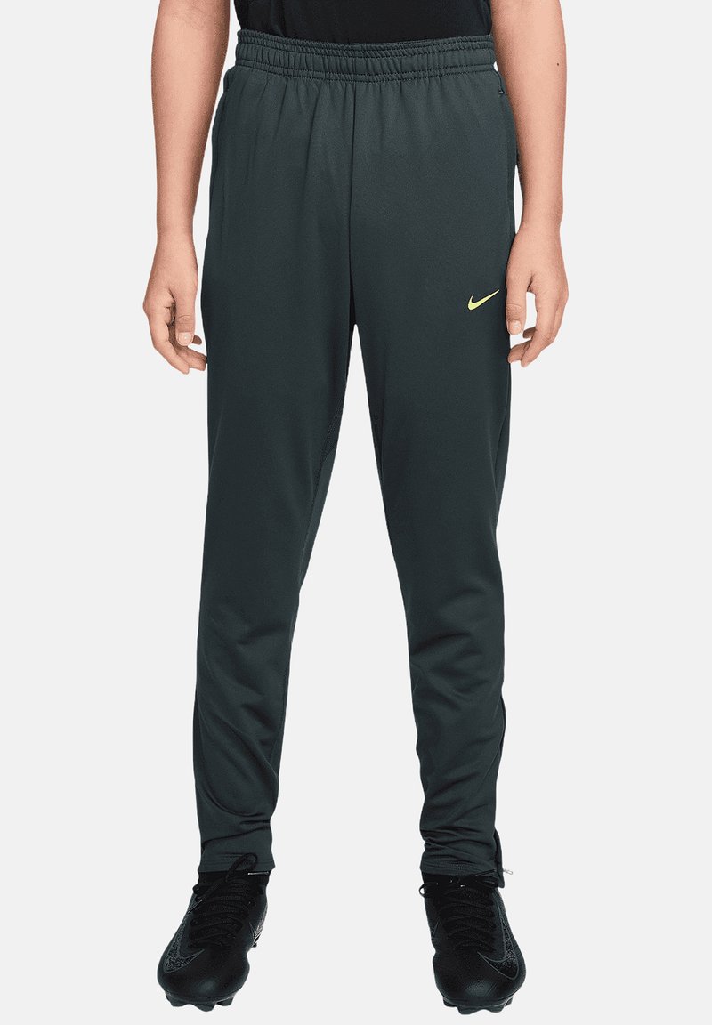 Dunkelgraue Sporthose mit elastischem Bund und gelbem Nike-Logo auf der linken Seite, gefertigt aus glattem, leichtem Stoff.