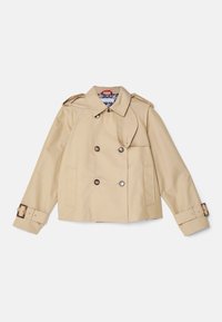 Trench-coat court beige à double boutonnage avec large col, épaulettes boutonnées, sangles à boucle aux poignets et poches latérales.