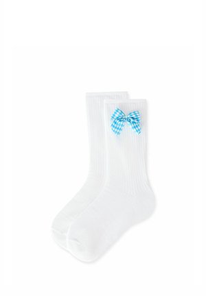 Pair of white ribbed socks with blue and white checkered bow attached near the top on one sock.