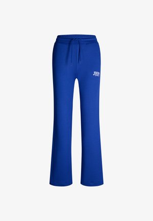 Pantaloni da jogging blu realizzati in un tessuto misto cotone. Presentano una cintura con cordoncino e un logo stampato sul lato sinistro. Design a gamba ampia.