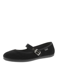 Zapatos Mary Jane planos de terciopelo negro con punta redonda, correa ajustable y hebilla, plantilla acolchada y suela de goma texturizada negra.
