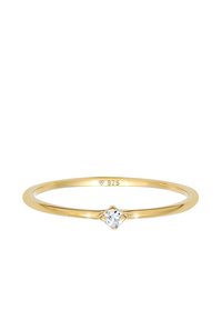 Gold-plated sterling silver ring featuring a small, round clear gemstone at the center, with a thin, smooth band and minimalist design.