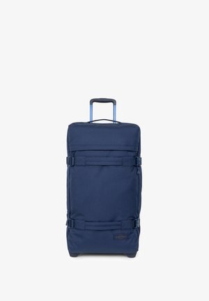 Marineblaue Rollkoffer aus strapazierfähigem Stoff, mit ausziehbarem Griff, zwei Sicherungsgurten und einer Fronttasche für Zubehör.