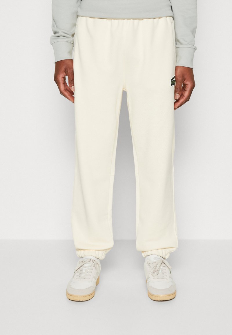 Lacoste UNISEX Tracksuit bottoms lapland/offwhite Zalando.co.uk