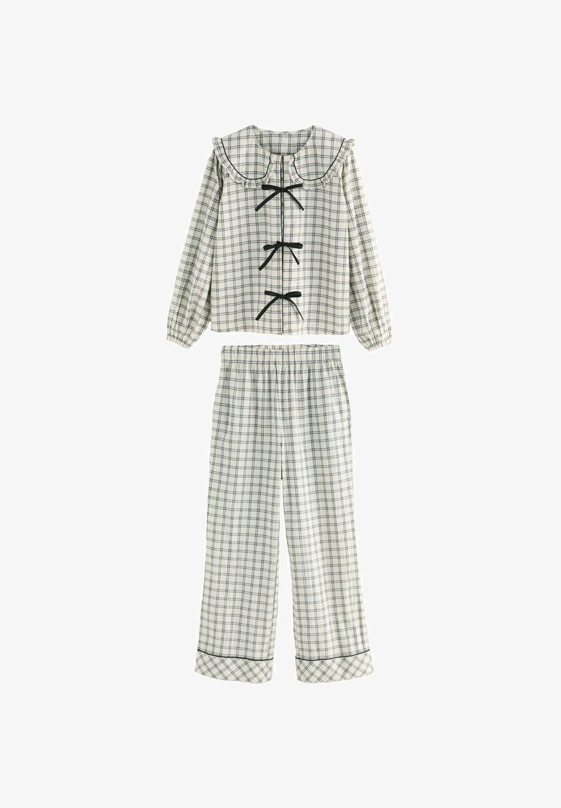 Ensemble de pyjama à carreaux en crème et bleu marine ; comprend un col froncé, trois nœuds noirs et un pantalon à taille élastique avec des détails assortis aux poignets.