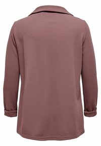 Camicia a maniche lunghe, con bottoni, in rosa polveroso. Tessuto testurizzato con una vestibilità comoda, caratterizzata da un colletto e maniche arrotolate.