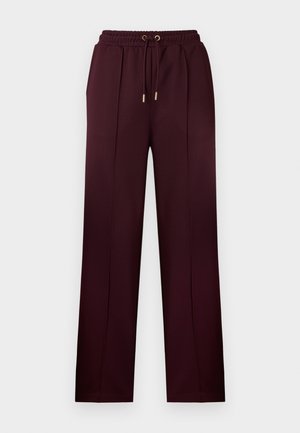 Vīnogu krāsas bikses no gludas auduma ar aukliņu jostas vietā, krokojumiem un brīva piegriezuma taisnām kājām. Dekorētas ar zelta toņa aparatūru.