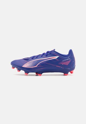 Blue soccer cleat with pink accents, featuring a sleek design, textured surface, and a lightweight construction for agility on the field.