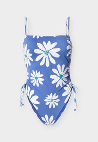 Μπλε ολόσωμο μαγιό με λευκό λουλουδάτο σχέδιο, λεπτές τιράντες και ρυθμιζόμενους δεσίματα στα πλαϊνά, σε μονόχρωμο φόντο.