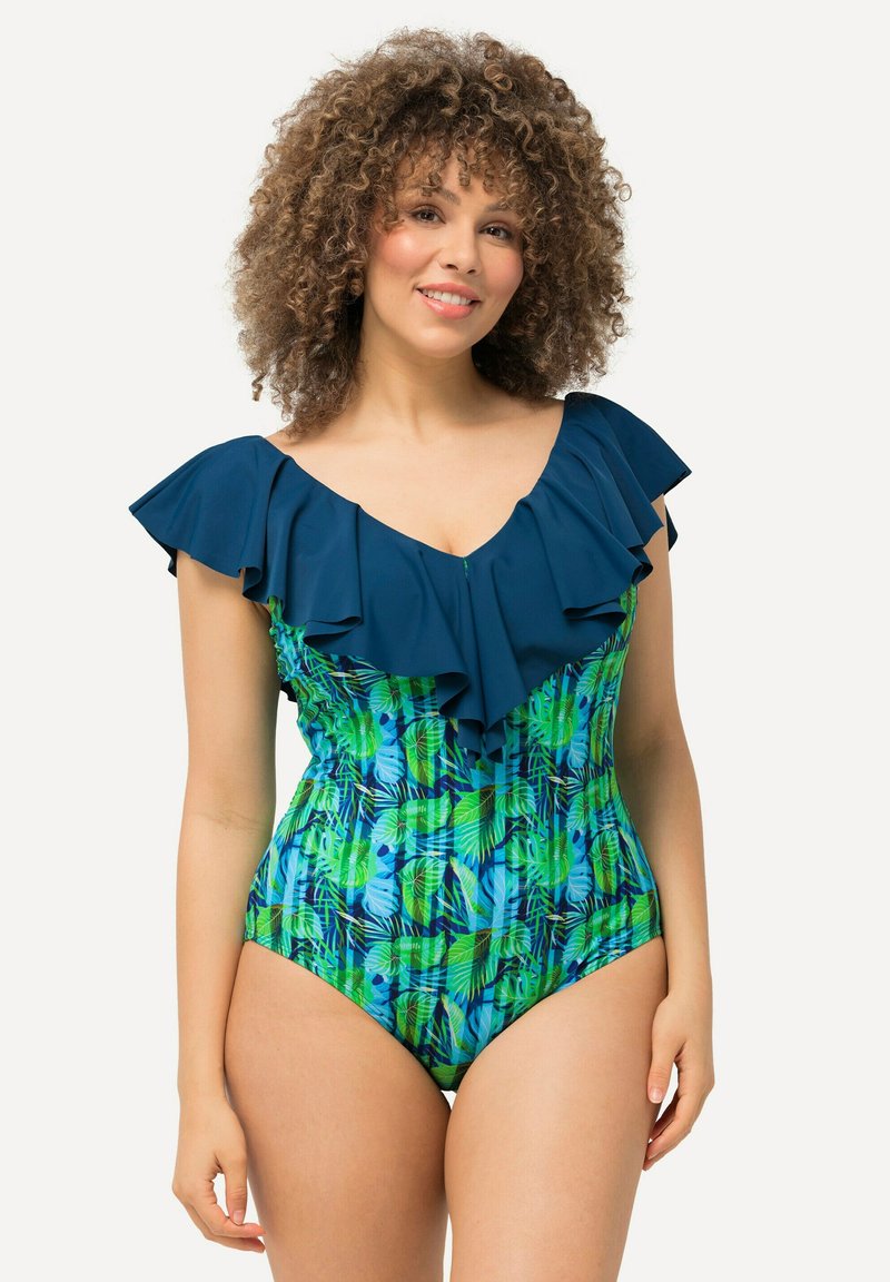 Maillot de bain une pièce avec un décolleté à volants navy, un motif de feuilles tropicales vertes et bleues éclatantes, et une silhouette ajustée.