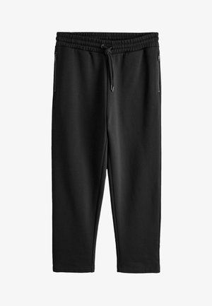 Mustad kitsenevad dressipüksid elastse vöökohaga, paelaga ja lukuga küljetaskutega, esitatud valgel taustal laotatult.